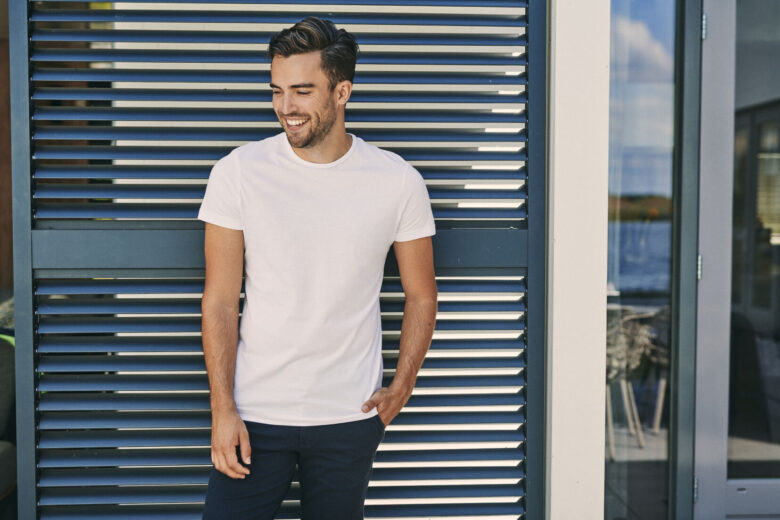 Man wearing white basic T-shirt that is GOTS certified.